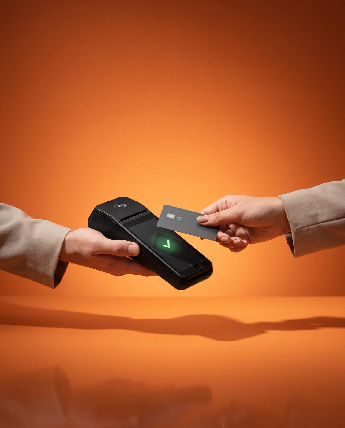 A contactless card tapped on a payment terminal